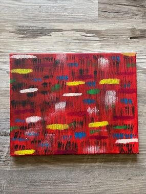 Abstract Red Canvas Painting with Bright Accent Strokes